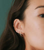 Crossover huggie earrings