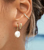 Crossover huggie earrings