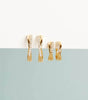 Crossover huggie earrings
